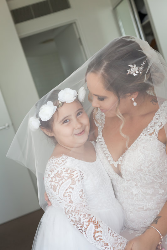 bride and her daughter under the veil